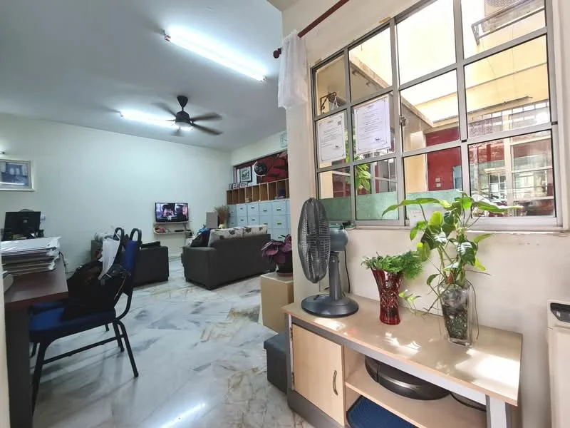 Living features: marble tile flooring, white painted walls, ceiling fan, wall-mounted TV, 3-seater fabric sofa in grey, coffee table, decorative plants, built-in cabinets, window with grid design, desk with chair; style: modern. Room features: white painted walls, marble tile flooring, ceiling fan.