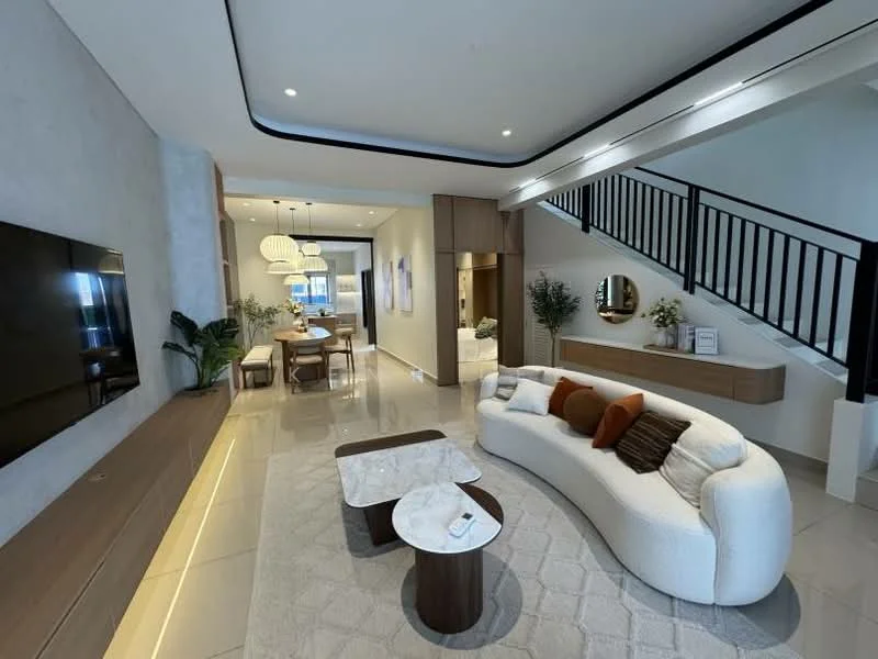 Living features: curved white fabric sofa, decorative cushions in orange and brown, coffee table with marble top, TV mounted on wall, light grey area rug, recessed ceiling lights, large windows with natural light, wooden console table, indoor plants, open-plan layout leading to dining area; style: modern. Dining features: wooden dining table, upholstered dining chairs, pendant lighting above dining table, decorative wall art, plant decor, open layout to living area; style: modern.