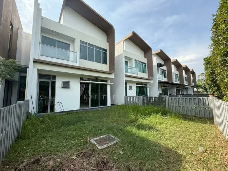 Exterior type: linked terrace house; features: two-storey building, white painted facade, flat roof with overhang, large windows with glass panels, balconies on upper floor, manicured lawn, fenced yard with wooden picket fence, surrounded by greenery, air conditioning unit visible, concrete pathway; style: modern.