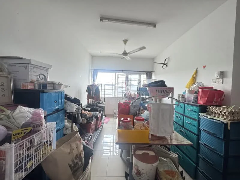 Room features: white painted walls, glossy tile flooring, ceiling fan, large window with sheer curtains, multiple storage cabinets, plastic storage bins, laundry baskets, various bags and boxes, clothes hanging on racks, table with assorted items.