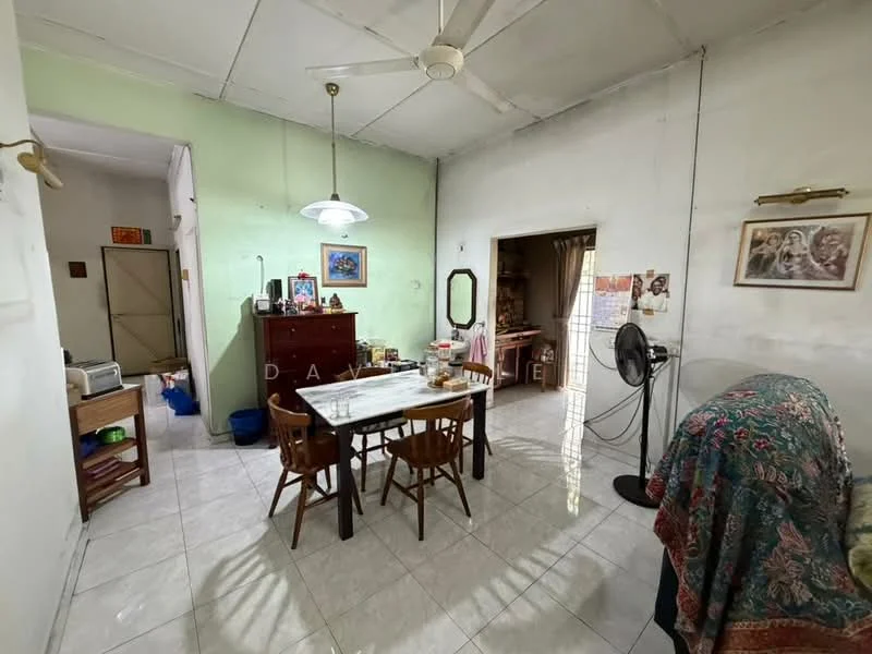 Dining features: white tiled flooring, green painted walls, dining table with four wooden chairs, ceiling fan, hanging pendant light, wall-mounted mirror, framed artwork, open doorway to adjacent room, window with natural light, decorative table with various items; style: traditional. Room features: white walls, open doorway, wooden furniture, fan.