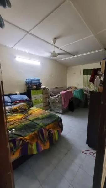 Bedroom features: queen-size bed with colorful bedding, ceiling fan, white painted walls, tile flooring, green curtains, built-in wardrobe, multiple storage boxes, bedside table, light fixture on ceiling.