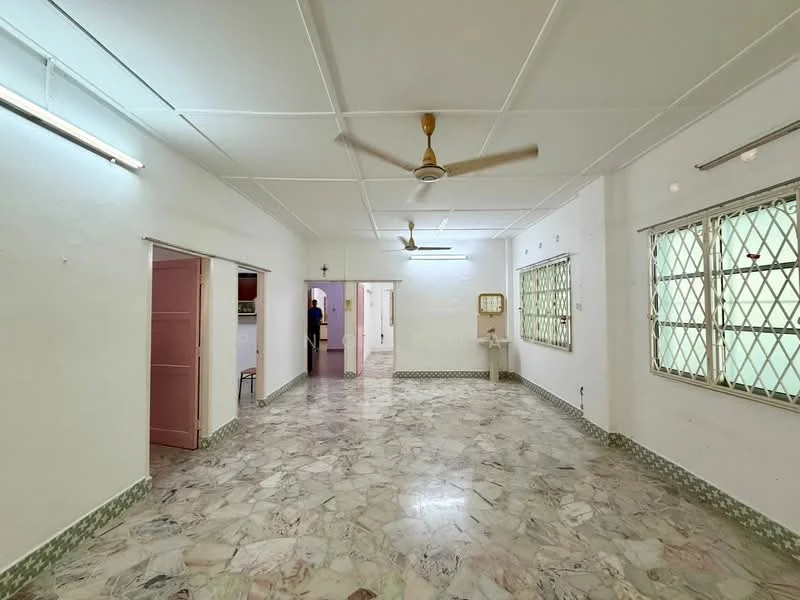 Room features: white painted walls, marble flooring, ceiling fan, multiple windows with metal grilles, light fixtures on ceiling, neutral color scheme, open layout, corner sink, doorway leading to another room; style: minimalist.