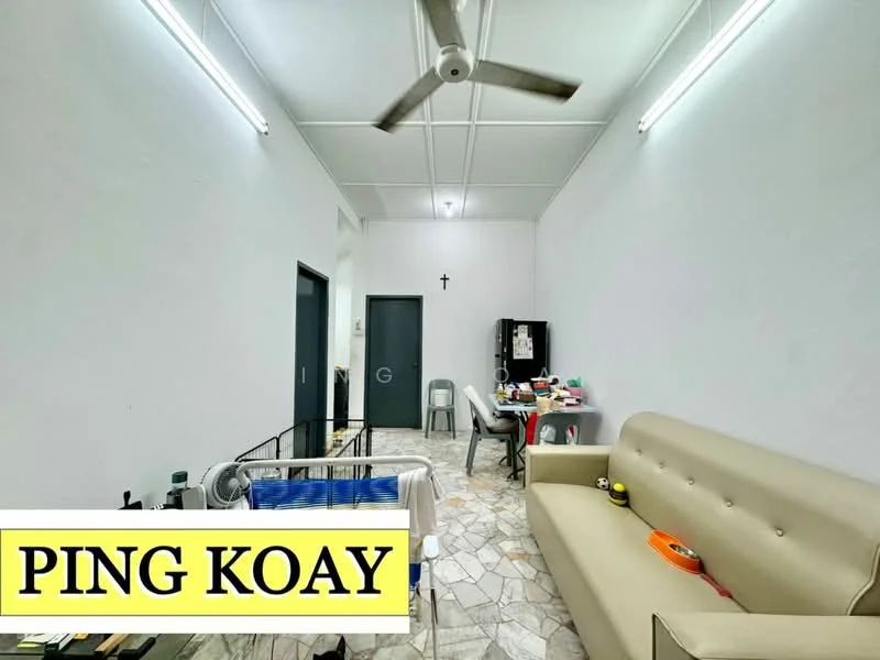 Living features: white painted walls, ceiling with exposed beams, marble tile flooring, 5-blade ceiling fan, sofa in beige, coffee table, wall-mounted TV, decorative wall cross, open shelving, dining chair, utility items on table; style: minimalist.