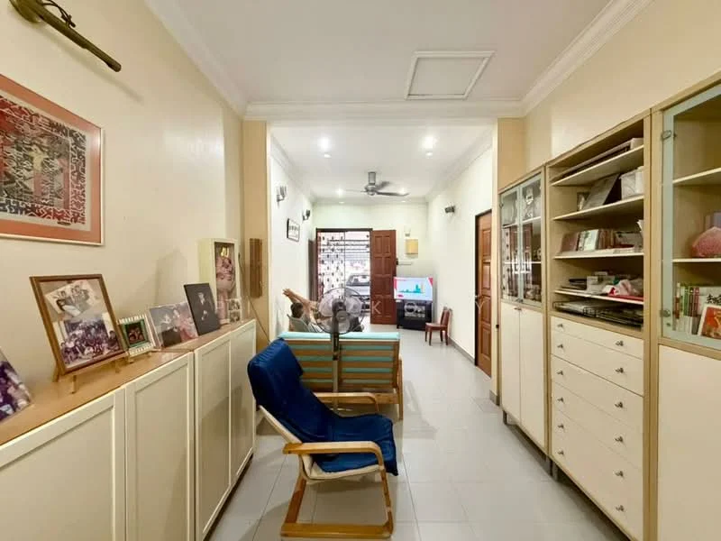 Room features: white painted walls, tile flooring, recessed downlights, 5-blade ceiling fan, wooden shelving unit, built-in cabinets, framed photographs, blue fabric armchair, wooden rocking chair, TV console, door leading outside; style: modern.