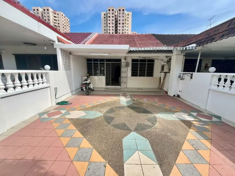 Exterior type: linked terrace house; features: paved courtyard with decorative tiles, white painted facade, red tiled roof, single-storey, surrounded by multi-storey buildings, outdoor lighting fixtures, motorbike parked in courtyard; style: modern.