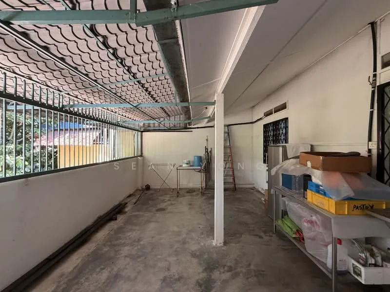 Room features: concrete flooring, white painted walls, metal roof with grid pattern, exposed beams, window grilles, open space layout, utility sink, storage shelves, ladder, plumbing fixtures; view: garden.