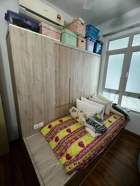 Bedroom features: wooden flooring, built-in wardrobe with wood finish, single bed with colorful bedding, decorative pillows, window with sheer curtains, storage boxes on top of wardrobe, air conditioning unit on wall, wall-mounted light fixture; style: modern.