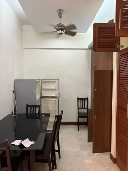 Kitchen features: black glass dining table, 4 wooden dining chairs, stainless-steel fridge, wooden cabinetry, ceiling fan, white painted walls, tile flooring, built-in storage cabinet; style: modern.