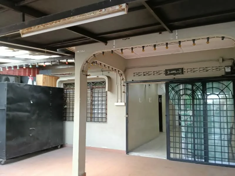 Room features: metal roof, concrete flooring, exposed beams, black sliding security door, window grilles, string lights, cream painted walls, open layout.