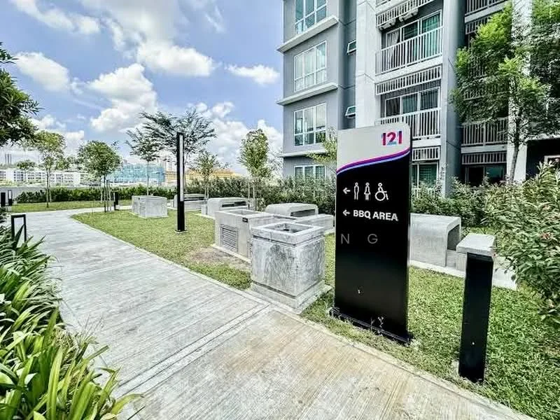 Exterior type: mid-rise condominium; features: BBQ area, landscaped garden, concrete seating areas, manicured lawn, pathway, surrounding greenery, signage for amenities; style: modern.