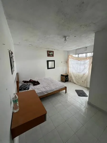 Bedroom features: white painted walls, plain ceiling, tile flooring, queen-size bed with wooden frame, nightstand with drawer, mirror on wall, window with sheer curtain, water bottle on nightstand, area rug, decorative artwork on wall; style: minimalist.