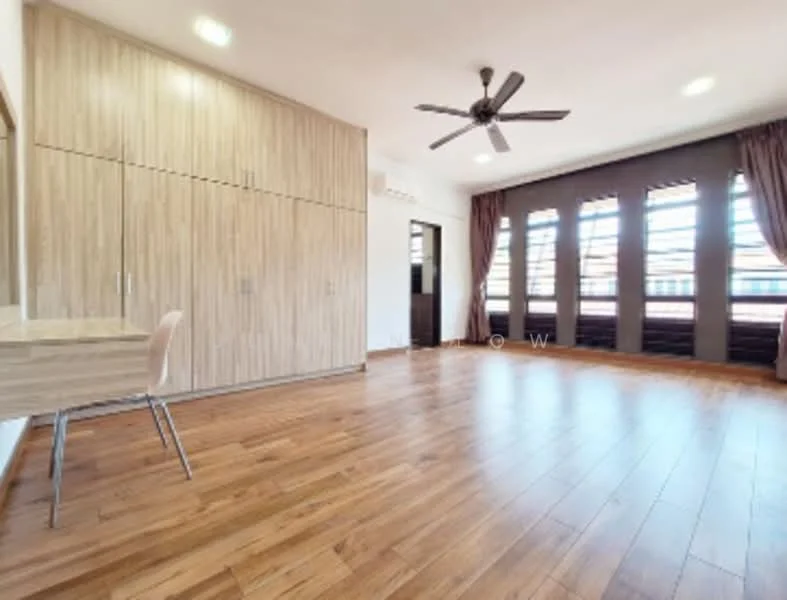 Room features: wooden flooring, light brown wood paneling on walls, ceiling fan, large windows with dark curtains, built-in wardrobe, study desk with chair, neutral wall color, natural light from windows; style: modern; view: city.