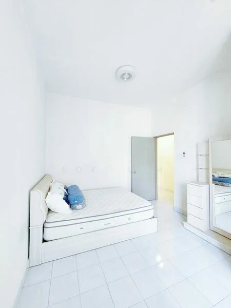 Bedroom features: white painted walls, white tiled flooring, single bed with mattress, upholstered bed frame in cream, built-in wardrobe with mirror, ceiling light fixture, door leading to hallway, window with no visible treatment; style: minimalist.