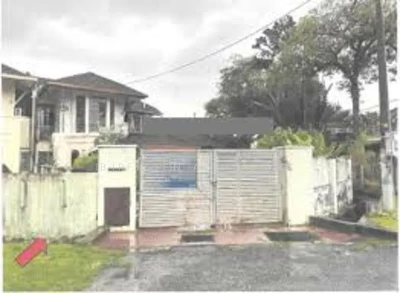 Exterior type: detached bungalow; features: gated entrance, metal gate, concrete wall, manicured lawn, paved driveway, surrounded by greenery, two-storey building, overcast sky; style: traditional.