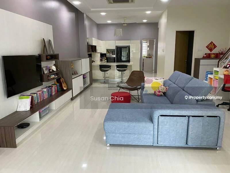 Living features: grey fabric sectional sofa, wooden TV console, wall-mounted flat-screen TV, open shelving with books, decorative cushions, recessed ceiling lights, cream painted walls, glossy tile flooring, dining area with bar stools, kitchen area visible in background, decorative wall art, houseplants in pots; style: modern.