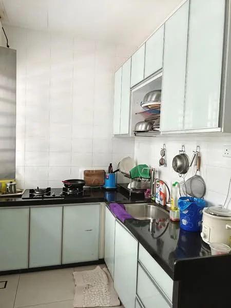 Kitchen features: black granite countertop, light blue glass cabinetry, stainless-steel gas hob, stainless-steel sink, chrome faucet, white tiled walls, ceramic tile flooring, open shelving, various cooking utensils, stacked plates, kitchen appliances, dish drying rack; style: modern.