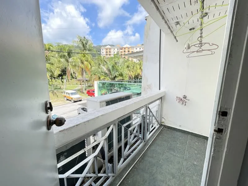 Room features: white walls, grey tiled flooring, balcony railing, clothes drying rack, outdoor view, palm trees visible, street view, sunny weather; view: garden.
