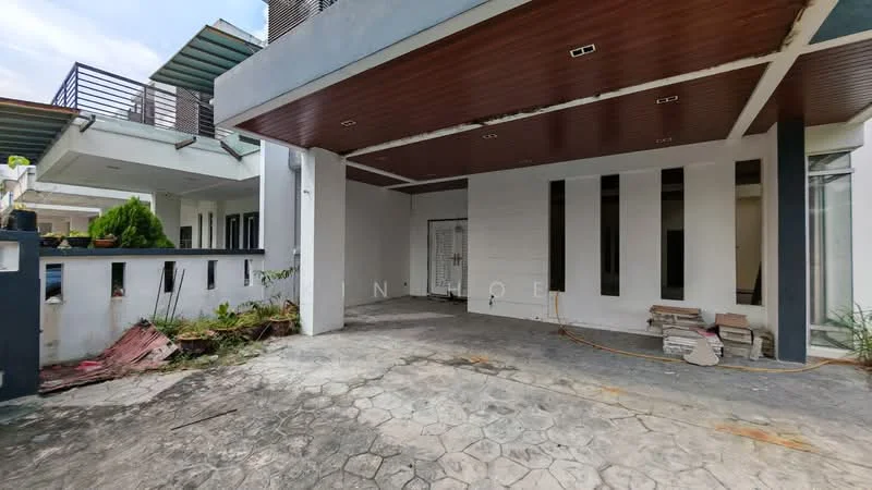 Exterior features: exposed concrete facade, wooden ceiling, open-air parking area, stone-paved flooring, landscaping with plants, partially finished walls, visible construction materials, surrounding greenery; style: modern.