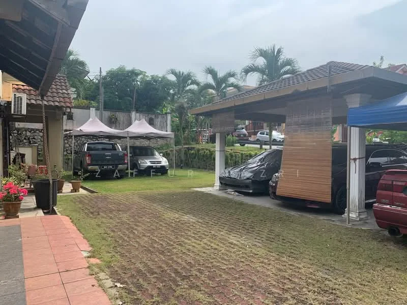 Exterior type: car porch; features: covered car porch with awning, two parked cars, manicured lawn, paved driveway, tents for outdoor events, surrounding palm trees, stone wall at the back; style: modern.