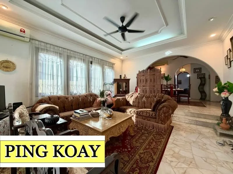 Living features: 3-seater fabric sofa in brown, 2-seater fabric sofa in brown, coffee table with decorative items, area rug with floral pattern, ceiling fan with light, marble flooring, white painted walls, large windows with sheer curtains, decorative wall art, wooden side table, decorative plant in ceramic pot, arched doorway leading to dining area; style: traditional.