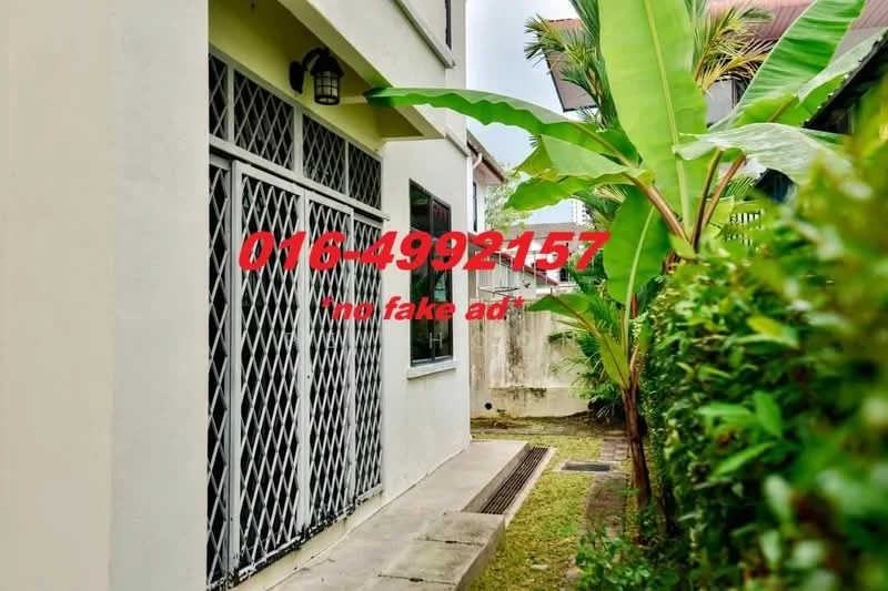 Exterior features: greenery with banana plants, manicured lawn, fenced garden, side pathway, metal grilles on windows, concrete wall, paved walkway.