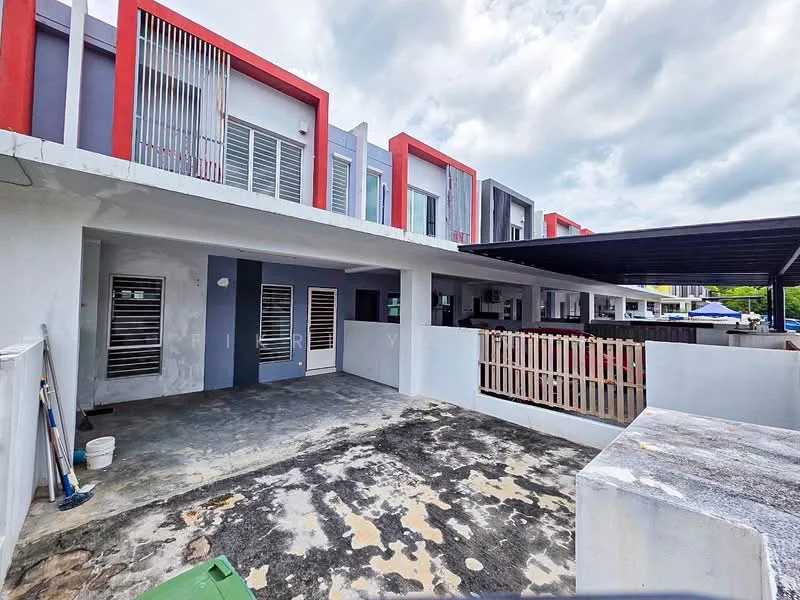 Exterior type: linked terrace house; features: two-storey building, concrete facade with red and grey accents, sliding glass doors, metal grilles on windows, covered car porch, exposed concrete flooring, fenced front yard, manicured landscaping, outdoor space with potential for garden, cloudy sky, adjacent terrace houses; style: modern.