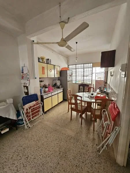 Kitchen features: yellow and white cabinetry, stainless-steel sink, chrome faucet, round dining table, four wooden dining chairs, ceiling fan, window with grid pattern, tile flooring, kitchen appliances visible, open shelving, refrigerator, countertop with utensils; style: traditional.