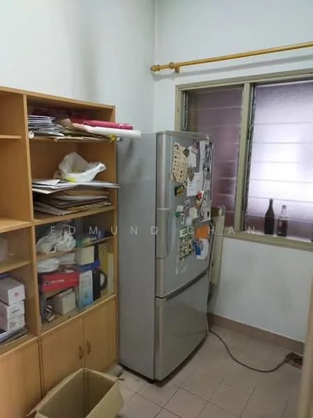 Kitchen features: stainless-steel fridge, wooden shelving unit, tile flooring, window with blinds, countertop space, various kitchen items on shelves, waste bin.