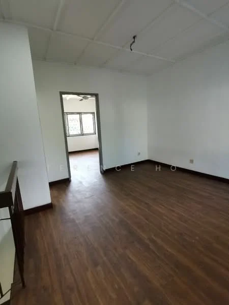 Room features: wooden flooring, white painted walls, ceiling with exposed beams, single ceiling light fixture, window with view to outside, doorway leading to another room.