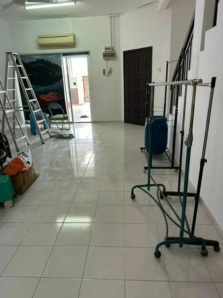 Room features: white painted walls, glossy tile flooring, ceiling-mounted air conditioning unit, staircase, metal ladder, clothes rack, blue water tank, green laundry basket, sliding glass door, natural light from window.