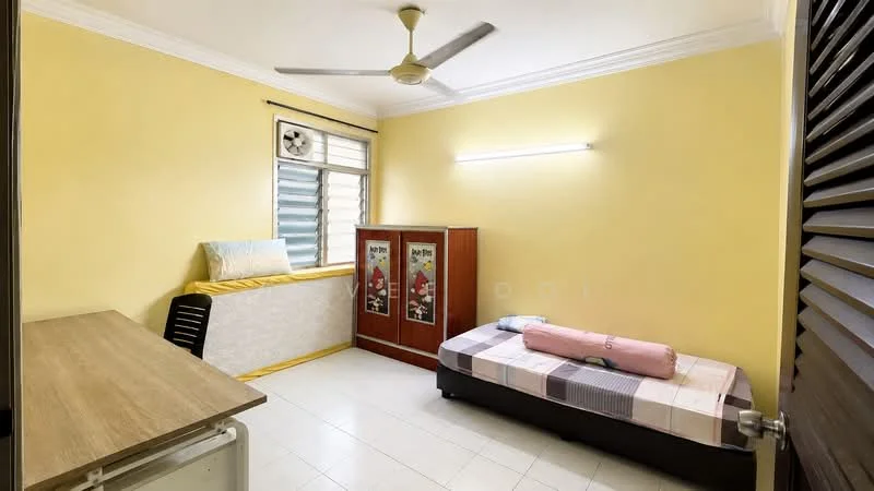 Bedroom features: yellow painted walls, white ceiling, 5-blade ceiling fan, window with blinds, single bed with mattress, bedside table, wooden wardrobe with sliding doors, study desk, tile flooring; style: modern.
