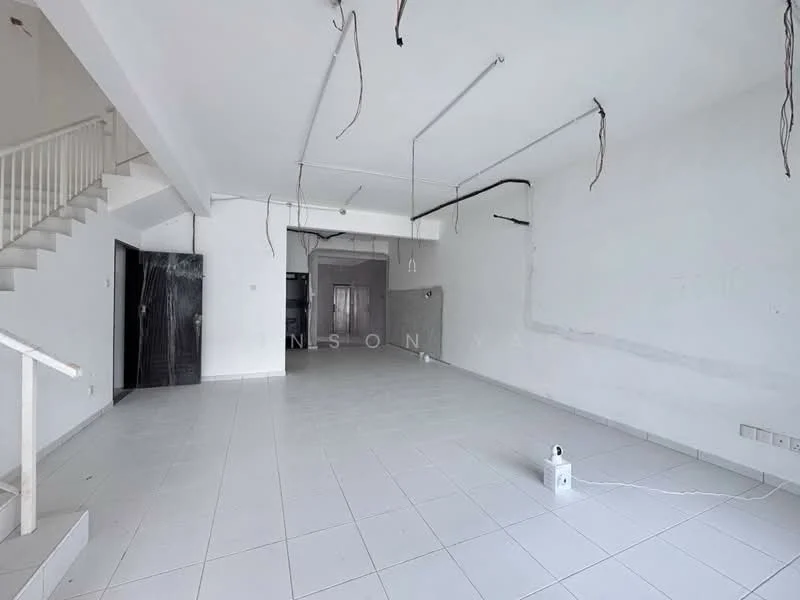 Room features: white painted walls, white tiled flooring, exposed ceiling with wiring, staircase leading to upper level, large open space, no visible furniture or decor, natural light from windows, empty room; style: minimalist.