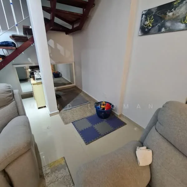 Room features: staircase with wooden railing, light grey fabric sofa, cream painted walls, tile flooring, area rug, blue storage bin, mirror on wall, decorative artwork on wall; style: modern.