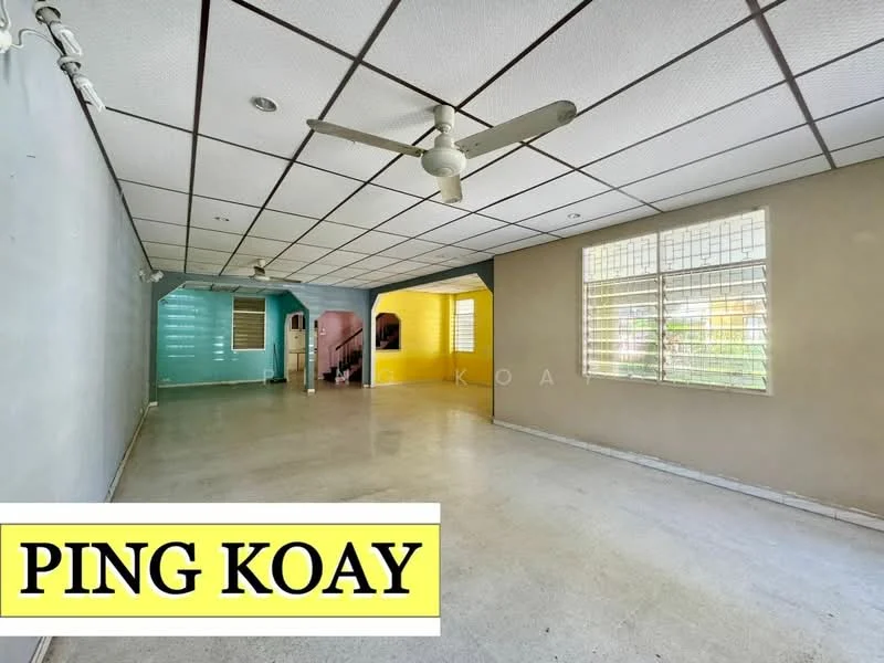 Room features: white painted walls, light grey flooring, exposed ceiling tiles, 2 ceiling fans, large windows with grilles, open layout, multiple wall colors (yellow and blue accent walls), no visible furniture; style: minimalist.