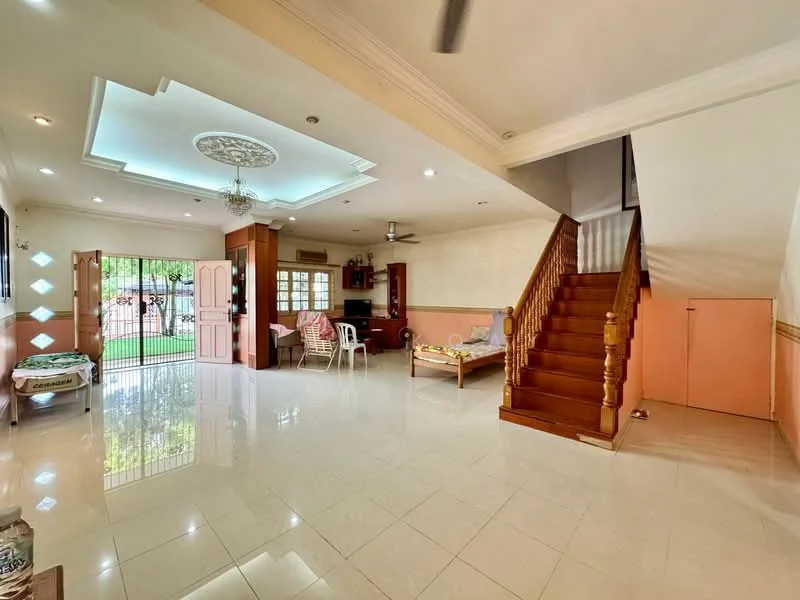 Living features: white painted walls, cream tiled flooring, tray ceiling with decorative molding, ceiling fan, large windows with security bars, wooden staircase, open layout, natural light from windows, dining area with table and chairs, sofa, decorative wall paneling; style: modern; view: garden.