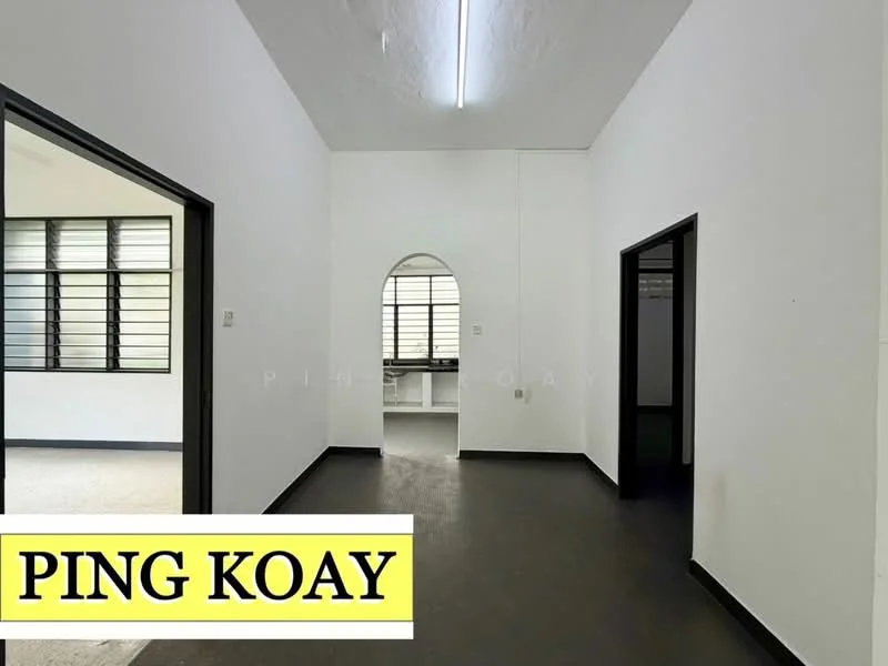 Room features: white painted walls, black door frames, black window frames, large windows with multiple panes, plain ceiling, dark flooring, arched doorway, neutral color scheme; style: minimalist.