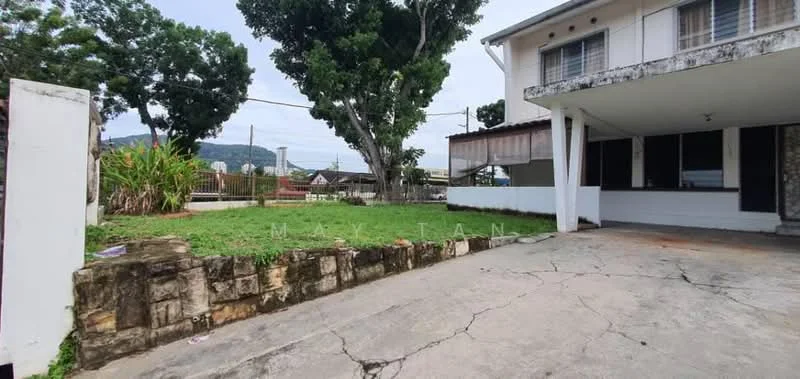 Exterior type: detached bungalow; features: manicured lawn, stone wall, concrete driveway, covered porch, large trees, open space, mountain view in background; style: traditional.