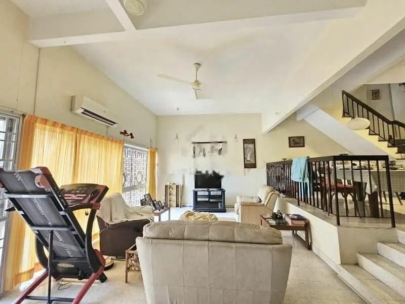Living features: cream painted walls, white ceiling, 5-blade ceiling fan, wall-mounted split AC, large windows with sheer curtains, 2-seater leather sofa in beige, 3-seater fabric sofa in cream, coffee table, TV console, freestanding TV cabinet, area rug, decorative wall art, staircase leading to upper level; style: contemporary.