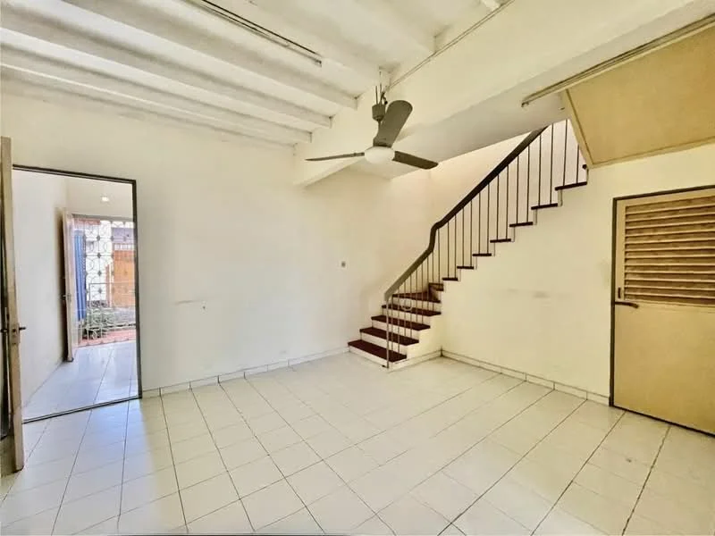 Living features: white painted walls, white ceiling with exposed beams, ceramic tile flooring, 5-blade ceiling fan, staircase with wooden steps, door leading to outdoor area, window with louvered shutters, open layout; style: minimalist.