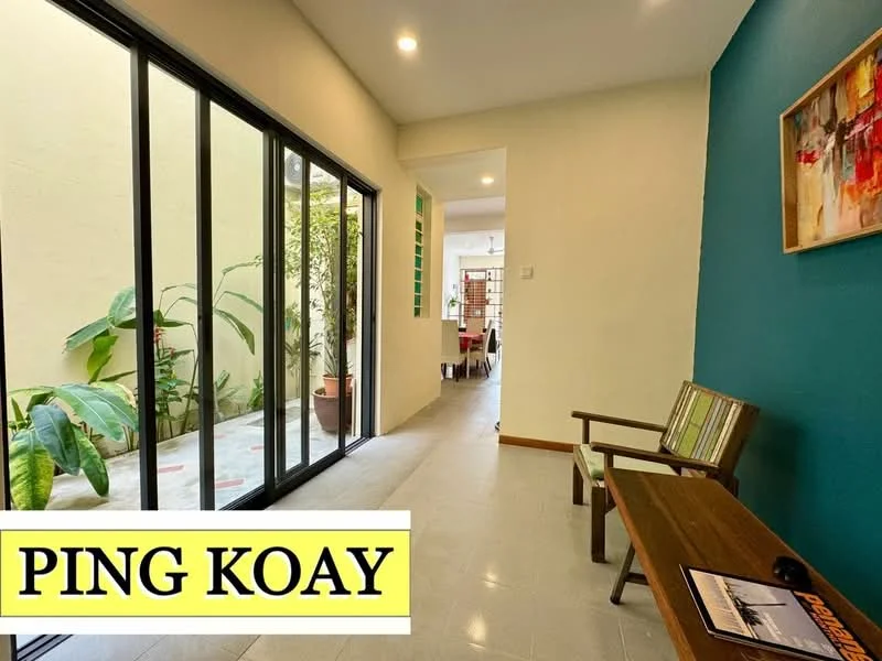 Room features: green accent wall, white painted walls, sliding glass door, floor-to-ceiling windows, ceramic tile flooring, wooden bench, decorative artwork, indoor plants; style: modern; view: garden.