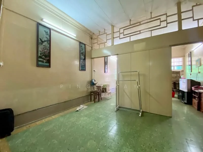 Room features: cream painted walls, green vinyl flooring, ceiling with exposed beams, wall-mounted fan, framed artwork on walls, wooden chair, clothes rack, built-in cabinetry, natural light from windows; style: traditional.