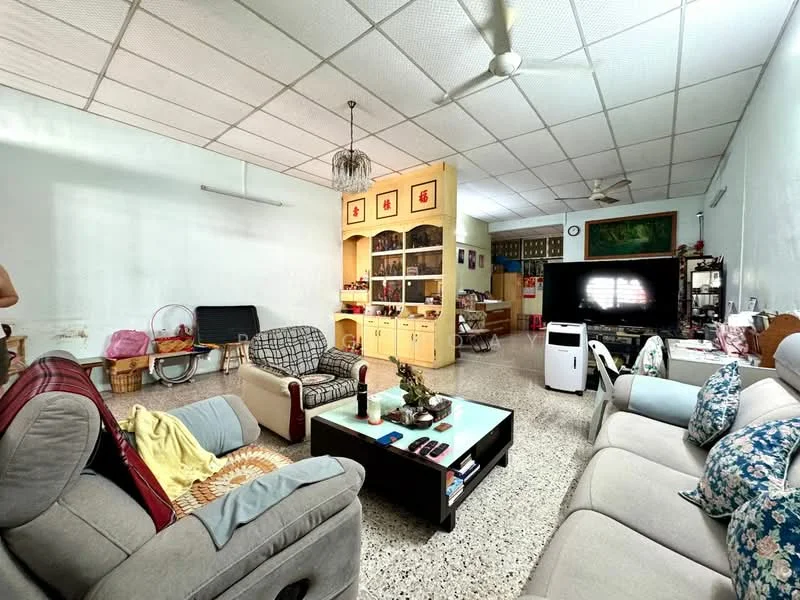 Living features: grey fabric 3-seater sofa, beige fabric 2-seater sofa, wooden coffee table, TV console with wall-mounted TV, decorative wall clock, ceiling fan, textured ceiling tiles, light-colored walls, speckled terrazzo flooring, built-in wooden cabinetry, decorative items on shelves, area rug with geometric pattern; style: traditional.