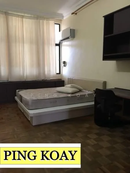 Bedroom features: wooden flooring, white painted walls, large window with sheer curtains, wall-mounted air conditioning unit, double bed frame without mattress, study desk, black office chair, built-in wardrobe, shelf unit above desk.