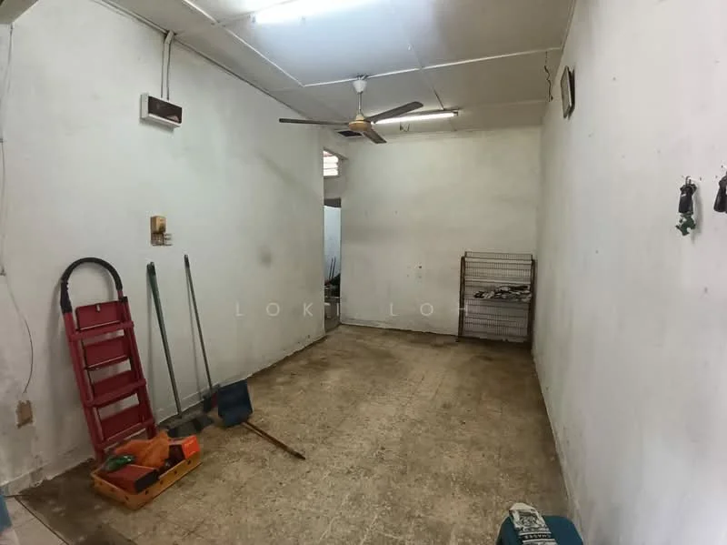 Room features: white painted walls, ceiling fan, concrete flooring, single light fixture, metal shelving unit, cleaning tools, broom, dustpan, spade, storage boxes.
