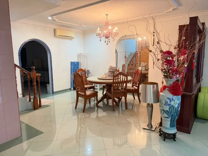Dining features: round dining table, 4 wooden dining chairs, chandelier with multiple bulbs, decorative vase with flowers, lampshade floor lamp, green accent chair, arched doorway, wall-mounted air conditioning unit, glossy tiled flooring, white painted walls, wooden staircase in background; style: traditional.