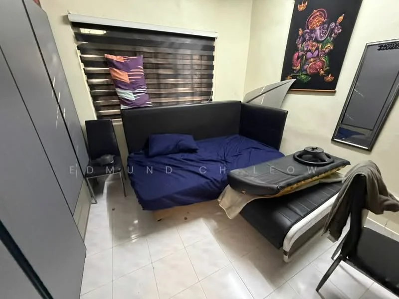 Bedroom features: queen-size bed with blue bedding, black upholstered headboard, grey wardrobe with sliding doors, black bedside table, black chair, white tiled flooring, window with horizontal blinds, decorative wall art, light-colored walls, foldable table; style: modern.