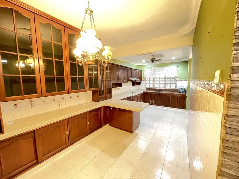 Kitchen features: brown wooden cabinetry, white tiled backsplash, cream countertop, built-in sink, chrome faucet, recessed ceiling lights, 5-blade ceiling fan, large window with sheer curtains, tile flooring, green painted walls, decorative stone wall feature; style: traditional.