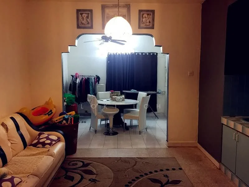 Living features: 3-seater fabric sofa in white with purple accents, area rug with circular pattern, ceiling fan, wall-mounted artwork, light fixture with pendant design. Dining features: round dining table, 4 upholstered dining chairs in white, curtains, clothes rack in background.