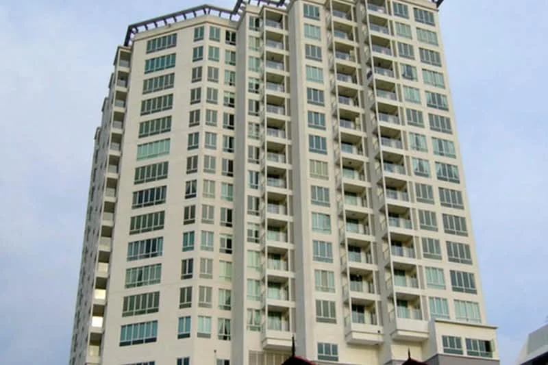 Exterior type: high-rise condominium; features: white painted facade, glass windows, recessed balconies, approximately 12-storey high-rise, flat roof, modern architectural design; style: modern.